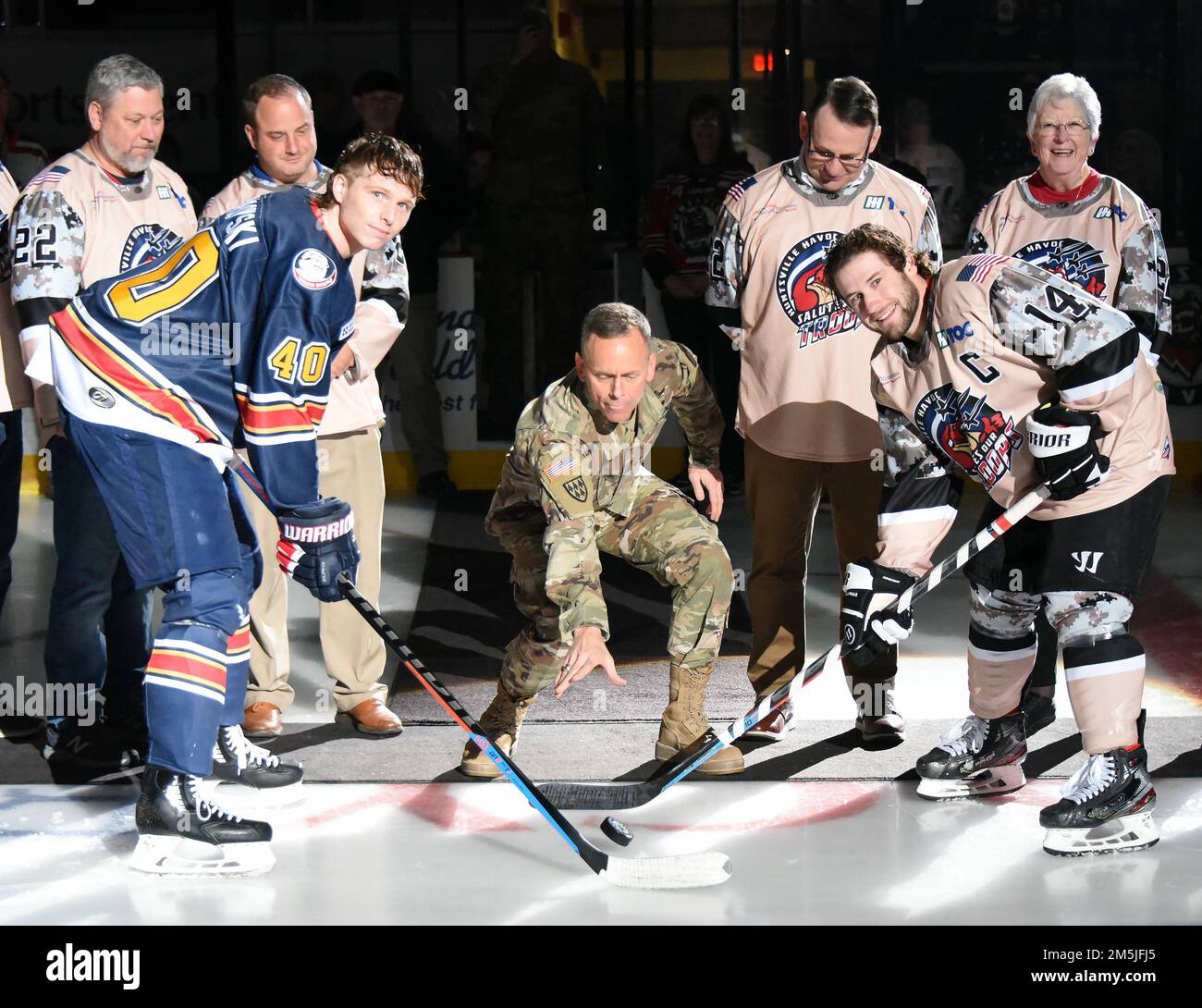 Lt. Gen. Daniel L. Karbler, commanding general, U.S. Army Space and Missile Defense Command, drops the ceremonial pregame puck during Military Appreciation Night at the Von Braun Center in Huntsville, Alabama, March 19. The Huntsville Havoc hosted the Peoria Rivermen. The evening included Soldiers rappelling from the ceiling, a future Soldier enlistment ceremony and a postgame jersey auction, featuring the jerseys worn by the Havoc players that night. Karbler also thanked Still Serving Veterans’ local chapter for sponsoring the event. Stock Photo