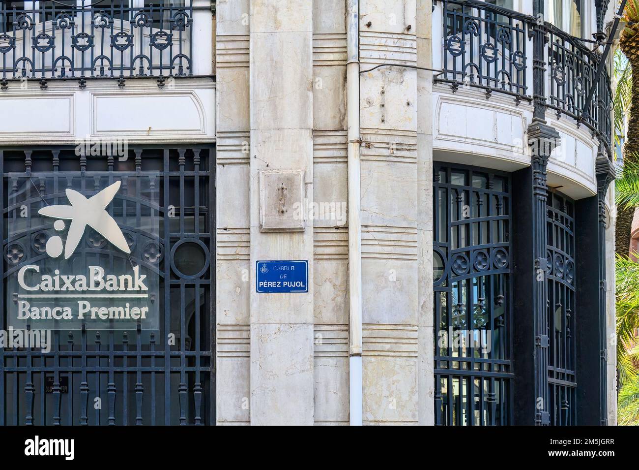A sign and logo of CaixaBank Banca Premier in the exterior of an old building. Stock Photo