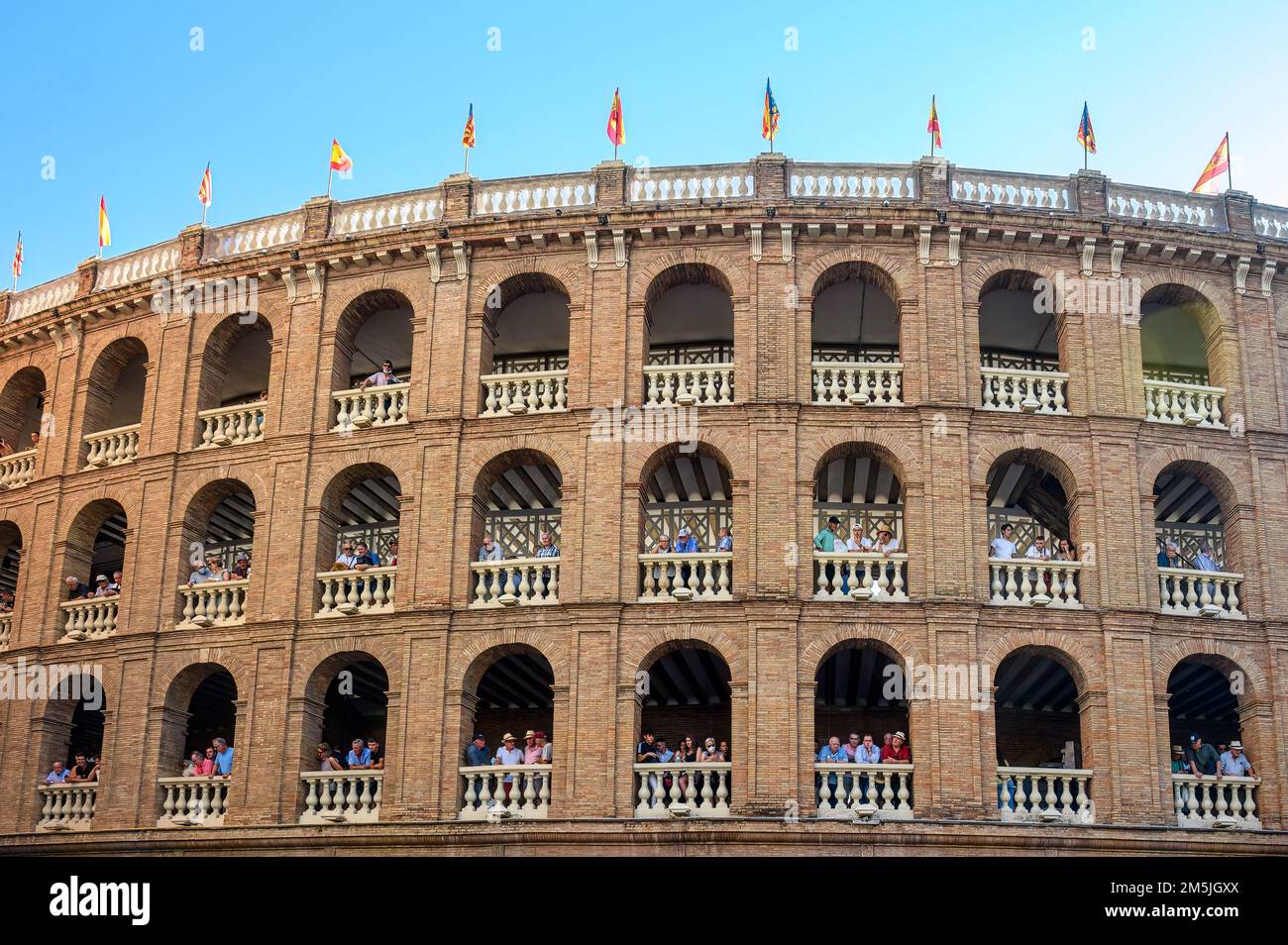 People in the balconies of the bullring. They are waiting for the bullfight event to start. Stock Photo