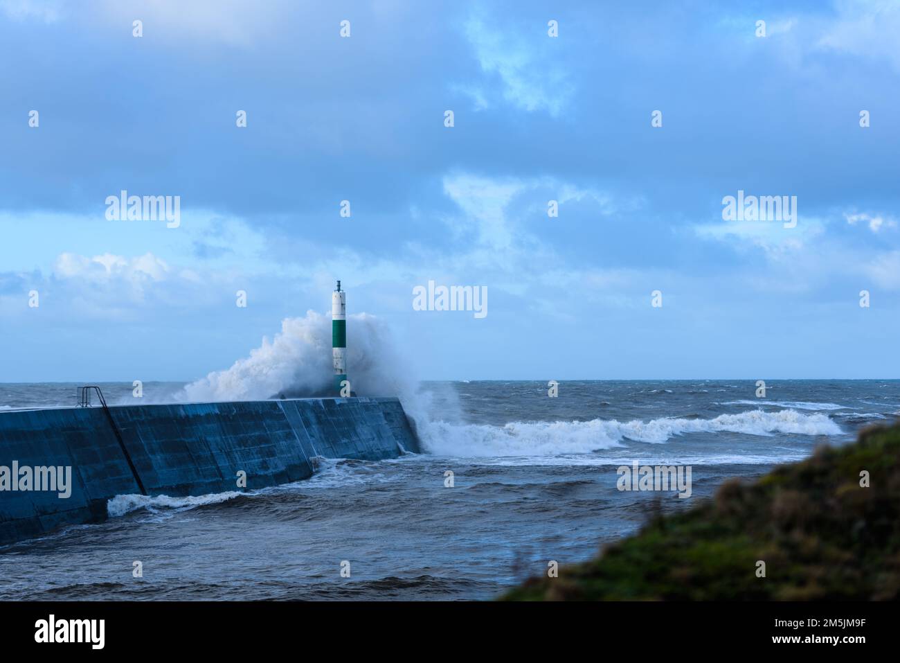 Rough seas batter the coastline of Aberystwyth, Wales. Stock Photo