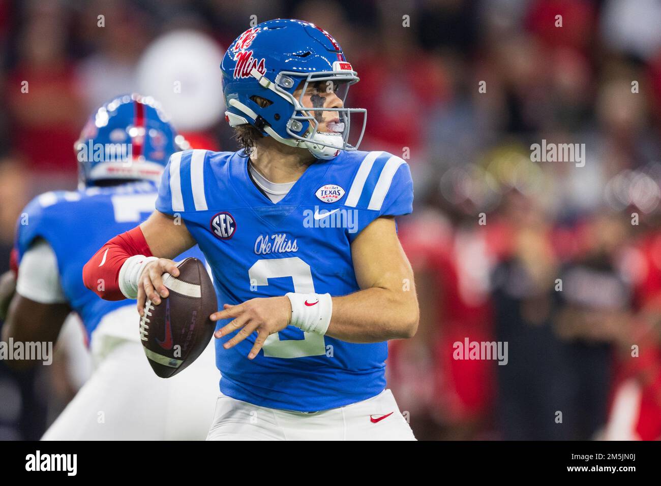 Ole Miss Rebels quarterback Jaxson Dart (2) looks to pass against the Texas Tech Red Raiders defense during the 2022 TaxAct Texas Bowl, Wednesday, Dec Stock Photo