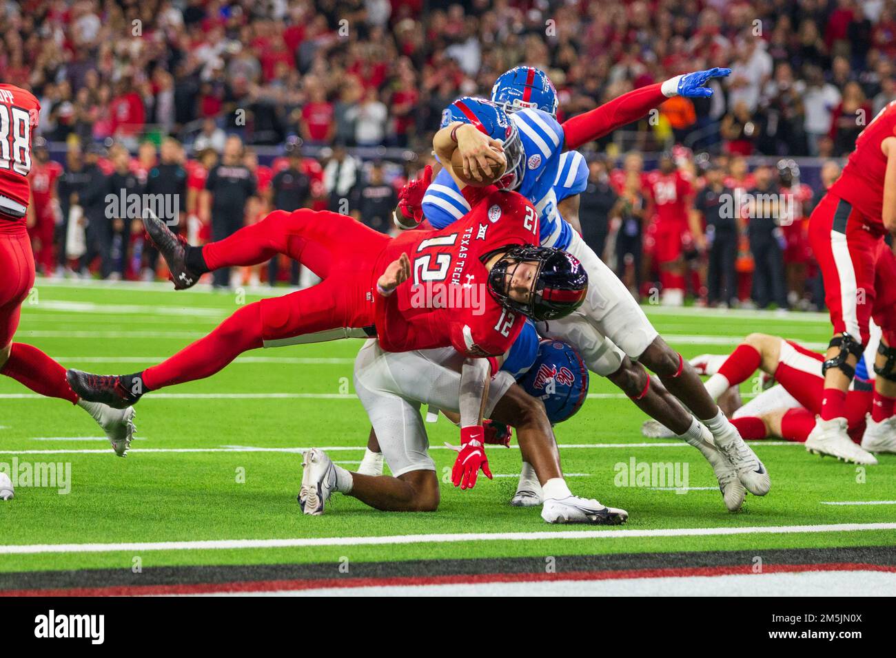 Texas Tech Red Raiders quarterback Tyler Shough (12) and Ole Miss Rebels linebacker Khari Coleman (23) collide at the goal line during the 2022 TaxAct Stock Photo