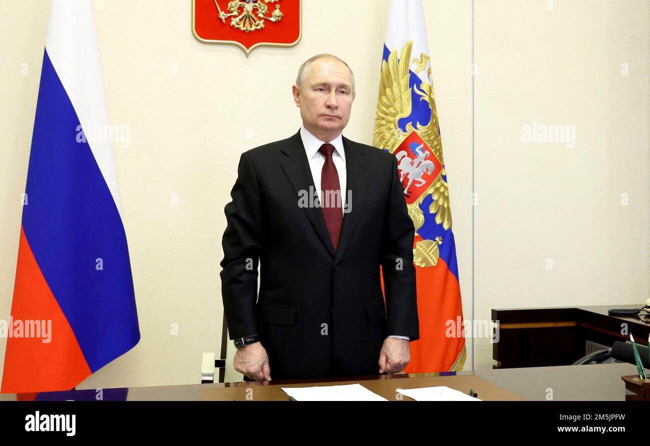 Novo-Ogaryovo, Russia. 29th Dec, 2022. Russian President Vladimir Putin stands during the launch ceremony of the the nuclear-powered cruise missile submarine Imperator Aleksandr III via video link from the official residence at Novo-Ogaryovo, December 29, 2022 outside Moscow, Russia. The Russian Navy took delivery of the sixth Borei-class ballistic missile submarine and launched the seventh at the Sevmash shipyard in Severodvinsk. Credit: Mikhail Klimentyev/Kremlin Pool/Alamy Live News Stock Photo