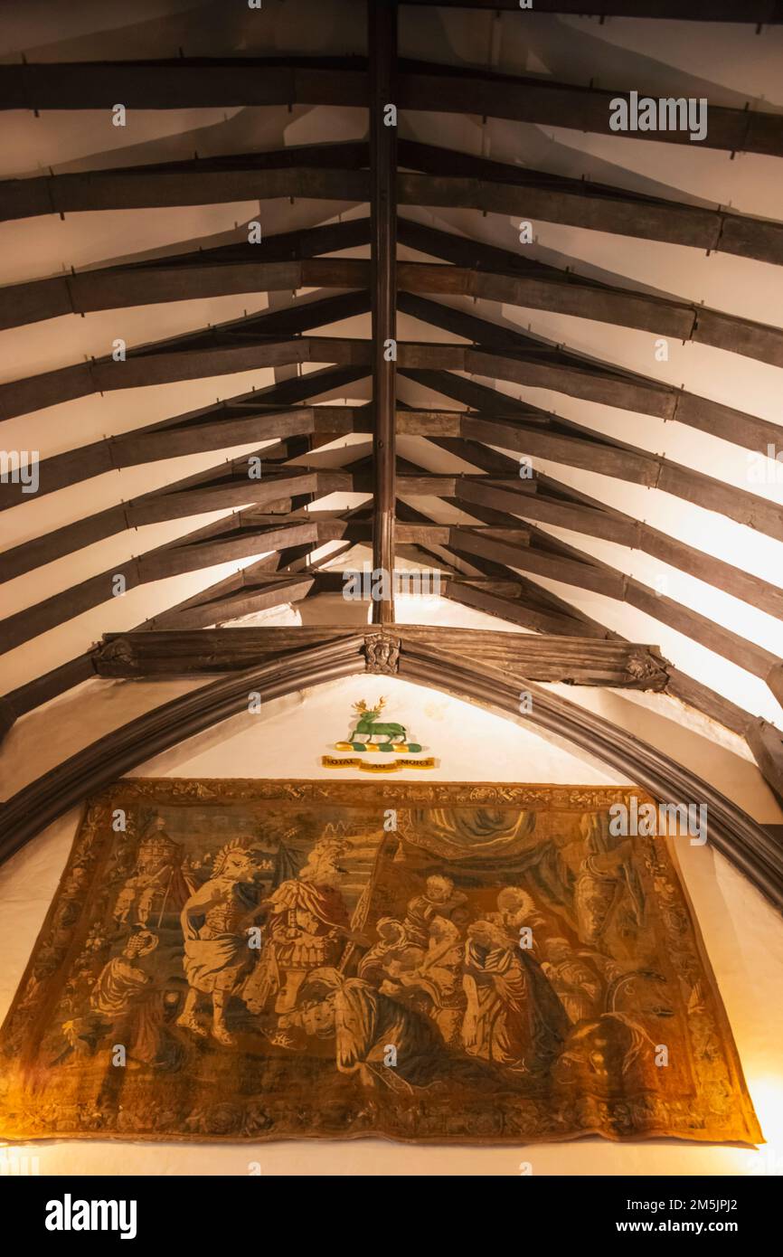 England, Kent, Sevenoaks, Ightham Mote, 14th century Moated Manor House, Interior View of The Great Hall, Ceiling Beams and Tapestry Stock Photo