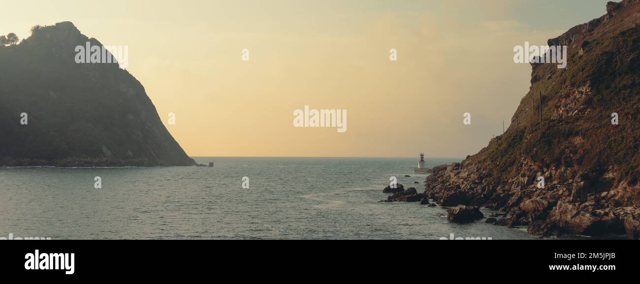 Lighthouse Panoramic A lighthouse in the bay at sunset, panoramic Stock Photo - Alamy