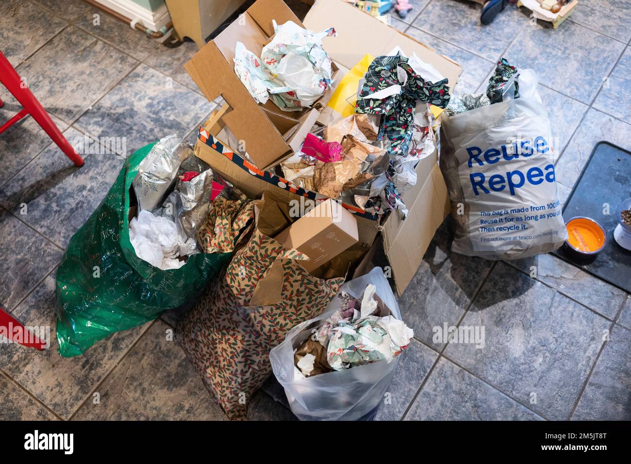 Discarded Christmas present wrapping paper in plastic bags ready for