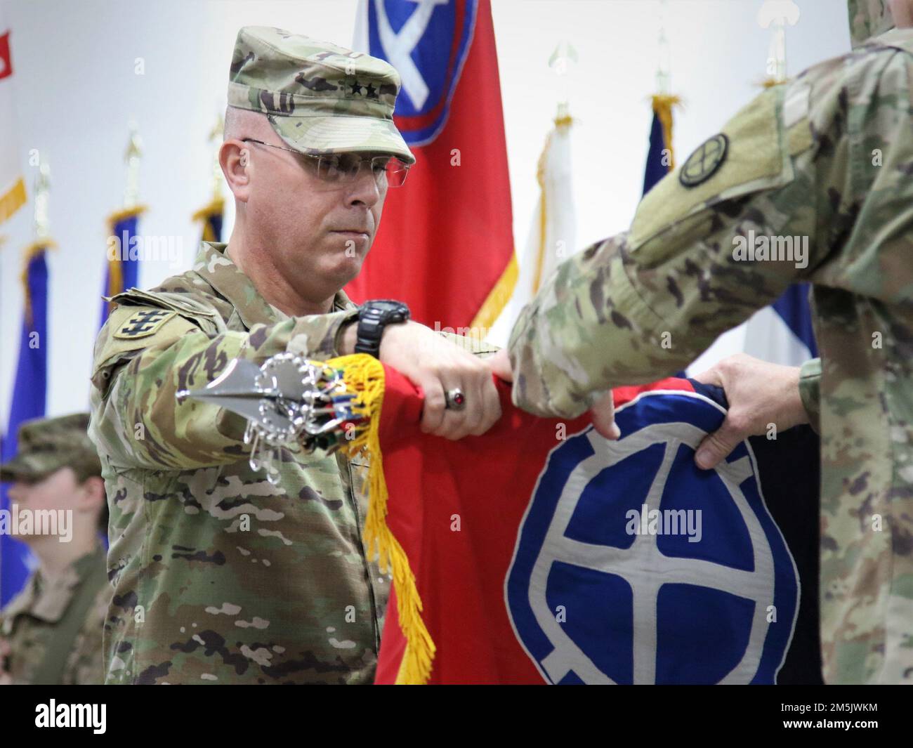 Maj. Gen. William Blaylock II, commanding general, 35th Infantry Division, Kansas Army National Guard, assumes command of Task Force Spartan from Maj. Gen. John Rhodes, commanding general, 29th Infantry Division, Virginia Army National Guard, on Camp Arifjan, Kuwait, March 20, 2022. Stock Photo