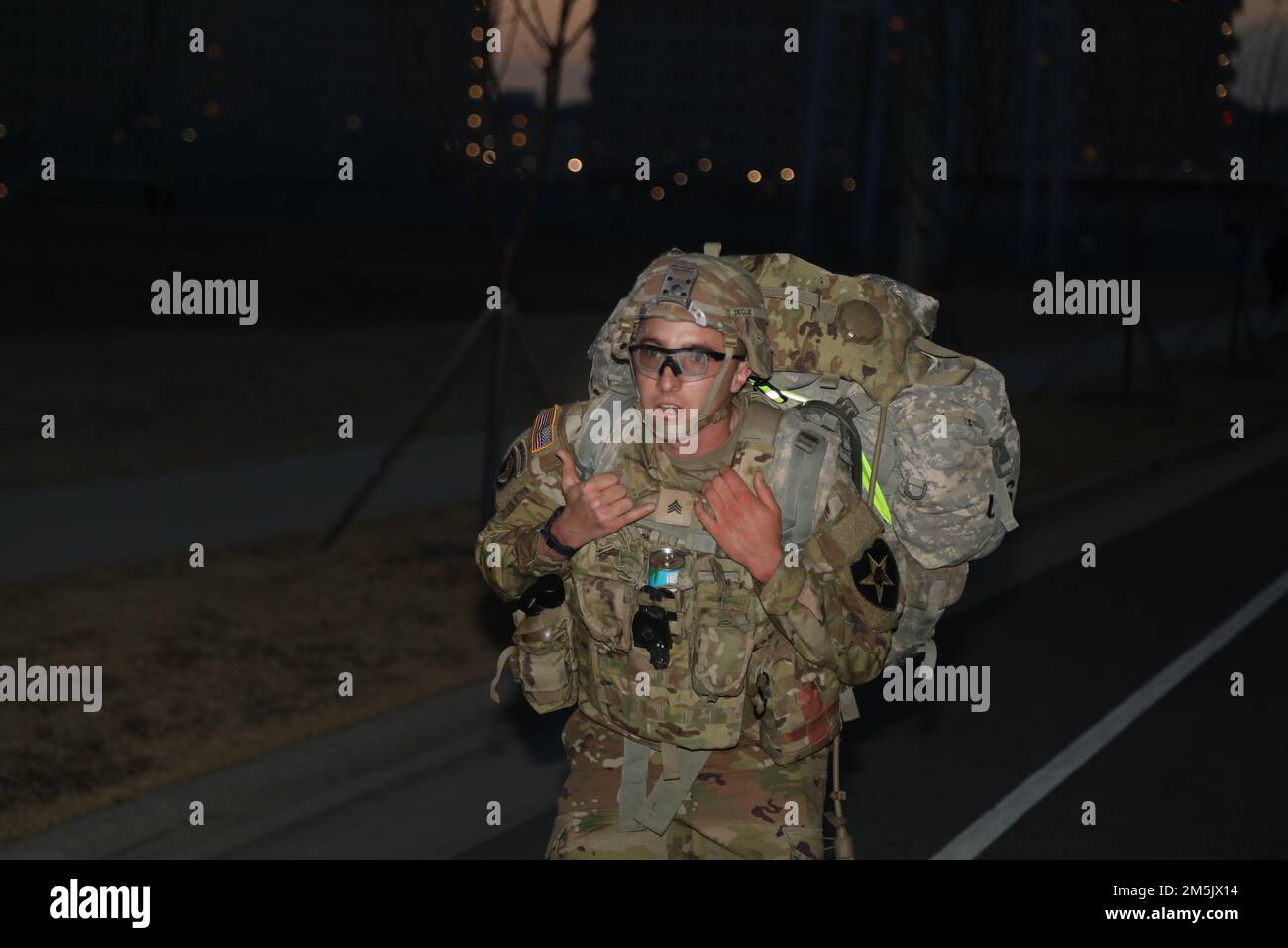 Sgt. Nathaniel Declue participates in the ruck march for the Best Warrior Competition, 21 Mar. 2022, Camp Humphreys, Republic of Korea. The BWC is held to recognize the best Soldiers of the 2CAB through various tests including a ruck march, obstacle course and a Soldier of the quarter board. Stock Photo