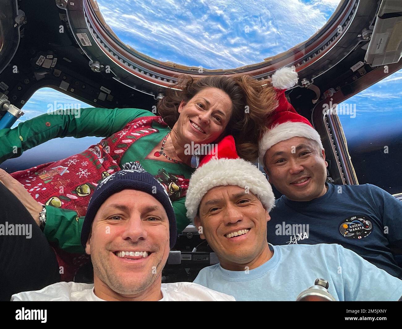 Earth Atmosphere. 25th Dec, 2022. Expedition 68 Flight Engineers (from left) Josh Cassada, Nicole Mann, and Frank Rubio, all from NASA, and Koichi Wakata of the Japan Aerospace Exploration Agency (JAXA), pose for a festive portrait on Christmas Day inside the cupola as the International Space Station orbited 270 miles above the southern Atlantic Ocean. Credit: NASA/ZUMA Press Wire Service/ZUMAPRESS.com/Alamy Live News Stock Photo