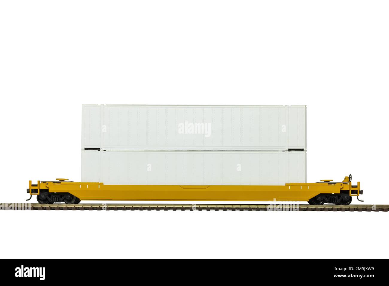 A yellow double stack intermodal railroad car on track. Stock Photo