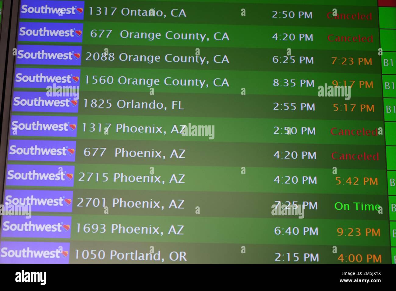 The departure board for on time, delayed and canceled flights for