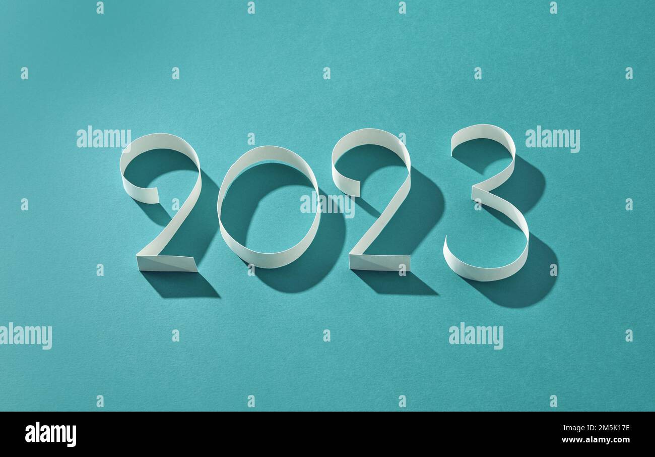 paper numbers two zero two three on blue background Stock Photo - Alamy