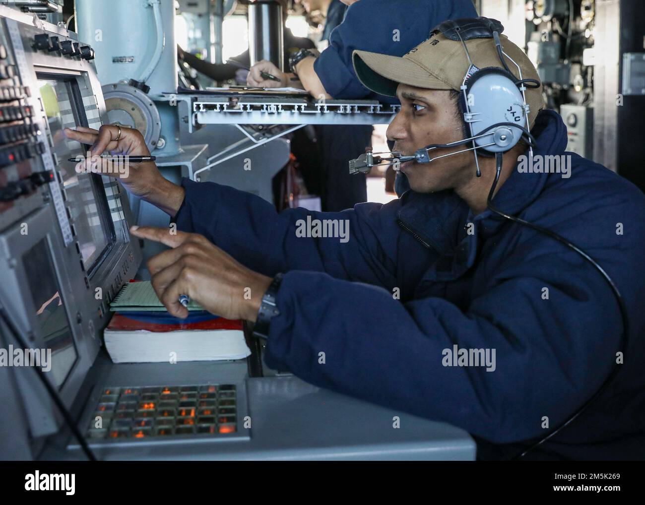 ATLANTIC OCEAN (March 21, 2022) –Lt. j.g. Nicholas Dortch mans a surface radar console in the pilot house aboard the Arleigh Burke-class guided-missile destroyer USS Porter (DDG 78), March 21. Porter, forward-deployed to Rota, Spain, is currently participating in Task Force Exercise in the U.S. 2nd Fleet area of operations. TFEX serves as the certification exercise for independent deploying ships and is designed to test mission readiness and performance in integrated operations. Stock Photo