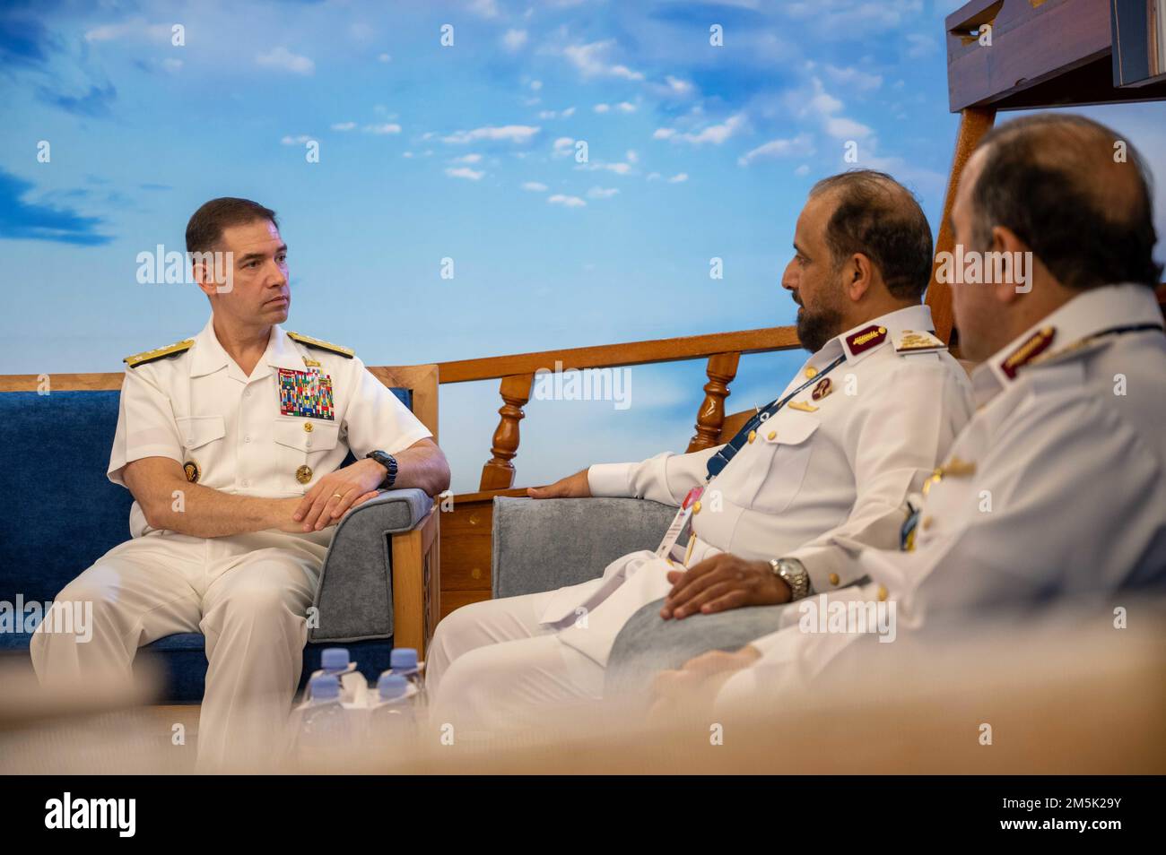 220321-N-OC333-1063 DOHA, Qatar (March 21, 2022) Vice Adm. Brad Cooper, commander of U.S. Naval Forces Central Command, U.S. 5th Fleet and Combined Maritime Forces, speaks to Maj. Gen. Abdullah Hassan Al-Sulaiti, commander of the Qatari Emiri Naval Forces, at the Doha International Maritime Defence Exhibition and Conference in Doha, Qatar, March 21. Cooper met with several military leaders at the event and discussed strengthening regional maritime partnerships. Stock Photo