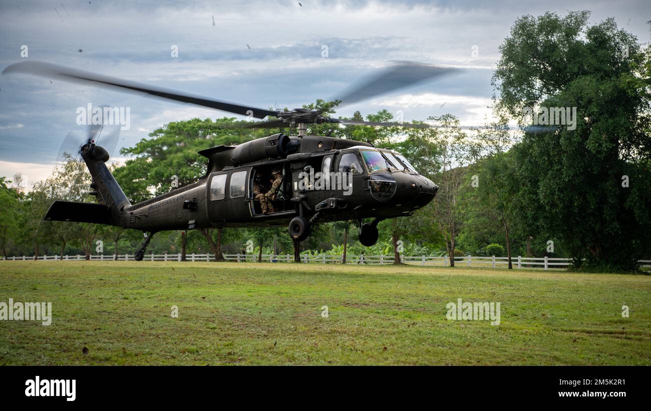 A U.S. Army UH-60 Black Hawk, assigned to the 2nd Assault Helicopter Battalion, 25th Aviation Regiment, 25th Infantry Division, takes-off for an air assault, Mar. 22, 2022, Fort Thanarat, Thailand. Air assaults allow troops to rapidly insert near an objective and utilize the element of surprise during the attack. Stock Photo