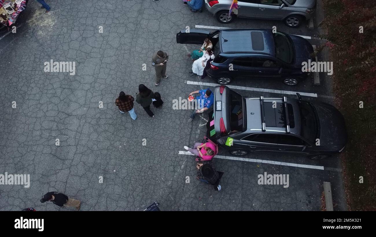 A top view of people with cars in a park enjoying time Stock Photo - Alamy