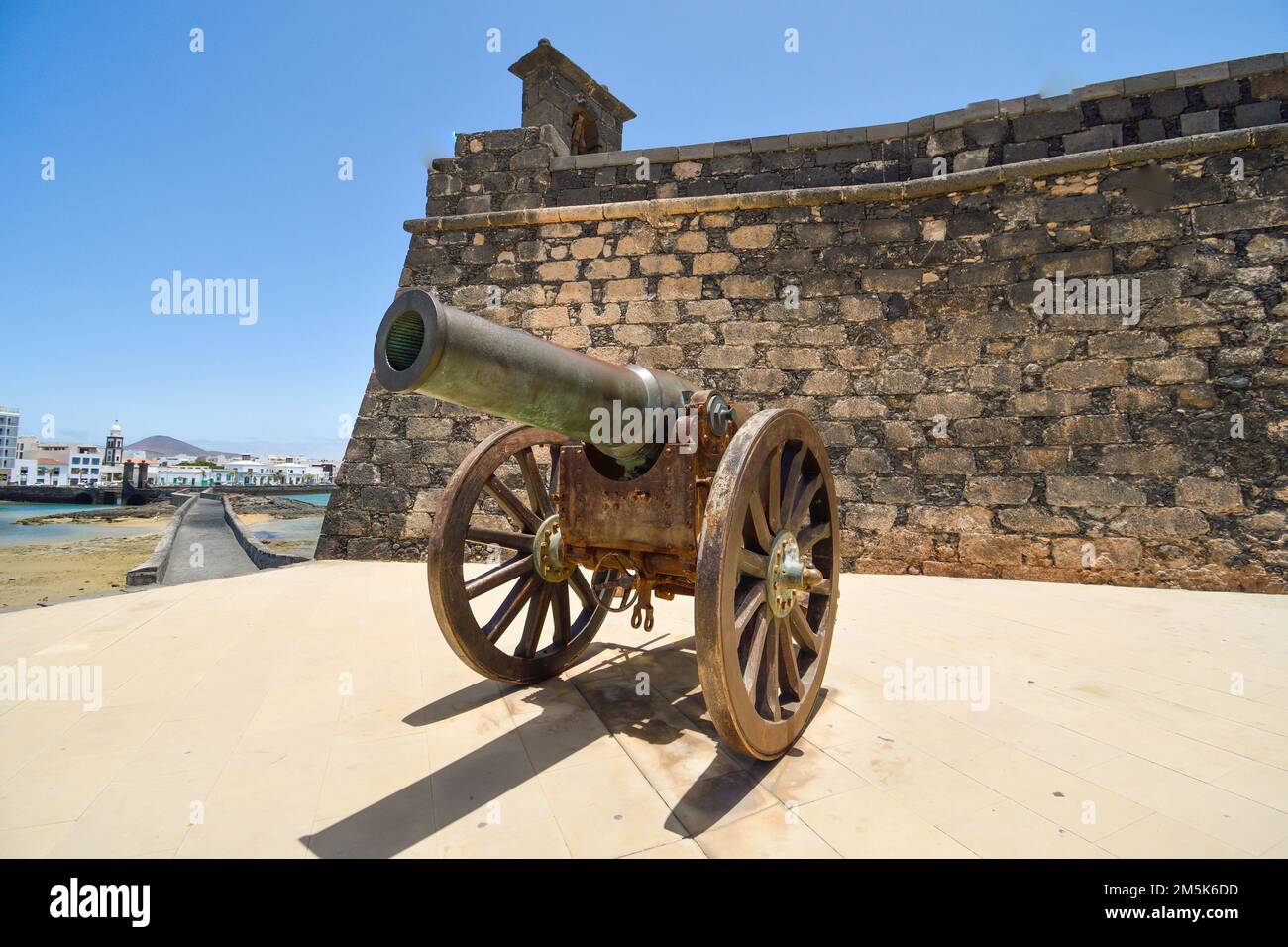 Old cannon of the Castillo de San Gabriel in Arrecife pointing towards the bay Stock Photo