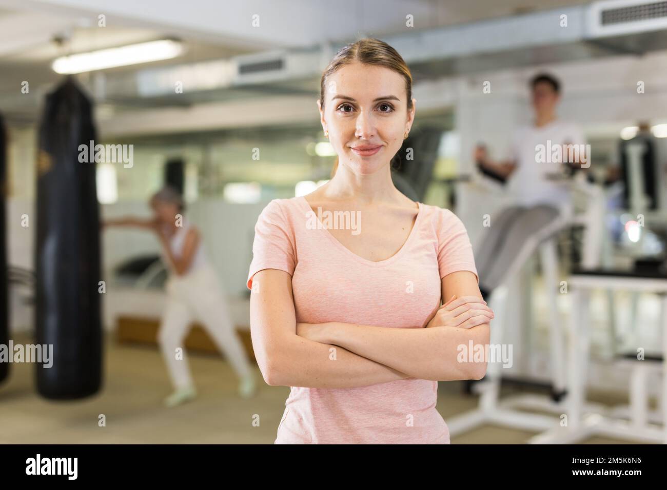 Portrait of woman standing in gym Stock Photo - Alamy