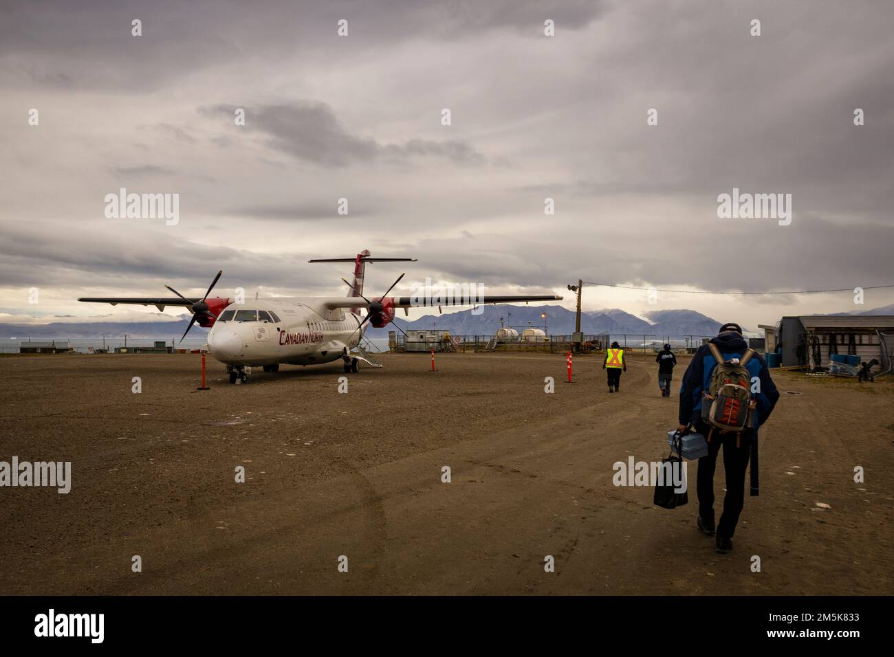 ATR 72 cargo and passenger aircraft belonging to Canadian North Airlines on the gravel airstrip at Pond Inlet, Baffin Island, Nunavut, Canada. Stock Photo