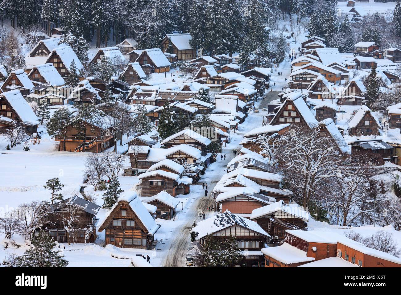 Main street through historic mountain village covered in snow Stock Photo