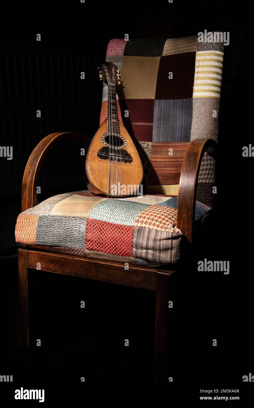 Patchwork Chair and Mandolin Stock Photo