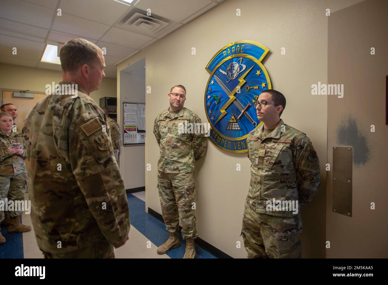 U.S. Air Force Lt. Gen. Gregory Guillot, Air Forces Central Command commander, presents an Airman assigned to the 432nd Wing/432nd Air Expeditionary Wing, with a coin for outstanding performance at Creech Air Force Base, Nevada, March 21, 2022. Guillot visited with the 30th Reconnaissance Squadron, 17th Attack Group, 732nd Operations Group, and Persistent Attack and Reconnaissance Operations Center to show his support and boost morale among the Airmen who work to make a mission of air dominance possible. Stock Photo