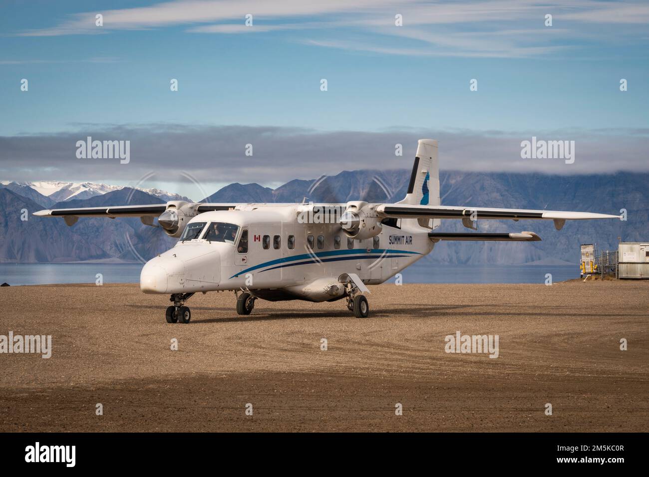 Dornier 228 airplane of Summit Air on the ground at Pond Inlet on Baffin Island, Nunavut, northern Canada. Stock Photo