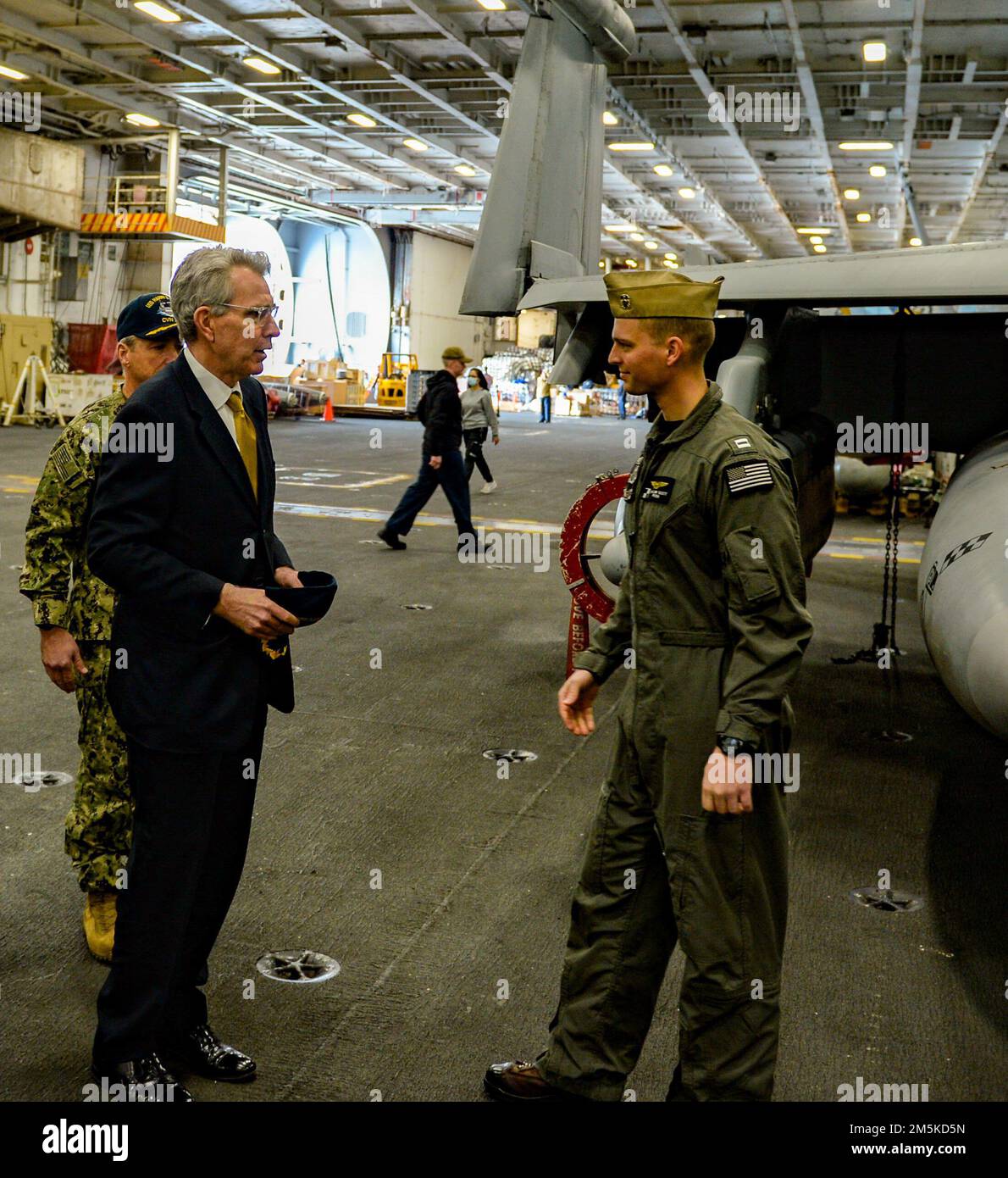 220322-N-FB730-1048 SOUDA BAY, GREECE (Mar. 22, 2022) U.S. Ambassador to Greece, Geoffrey R. Pyatt, speaks to Lt. Taylor Scott, from Bellevue, Nebraska, assigned to the 'Rooks' of Electronic Attack Squadron (VAQ) 137, during a visit aboard the Nimitz-class aircraft carrier USS Harry S. Truman (CVN 75), Mar. 22, 2022. The Harry S. Truman Carrier Strike Group is on a scheduled deployment in the U.S. Sixth Fleet area of operations in support of U.S., allied and partner interests in Europe and Africa. Stock Photo