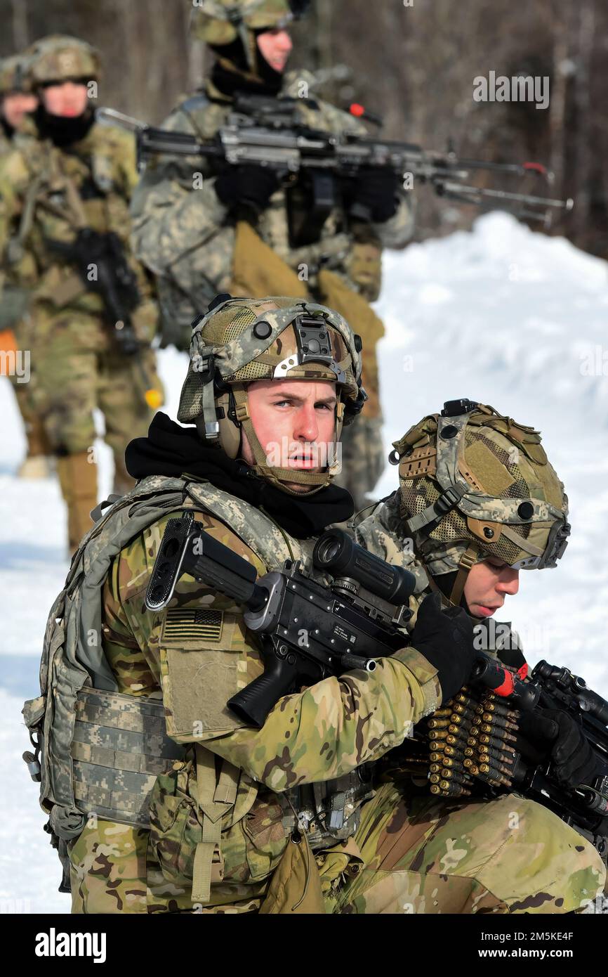 Dismounted infantrymen from the 3rd Battalion, 21st Infantry Regiment move to contact through the Donnelly Training Area during Joint Pacific Multinational Readiness Center 22-02, March 22, 2022. This exercise is designed to validate U.S. Army Alaska’s 1st Stryker Brigade Combat Team, 25th Infantry Division’s cold weather training, readiness and capabilities.  (Army photo/John Pennell) Stock Photo