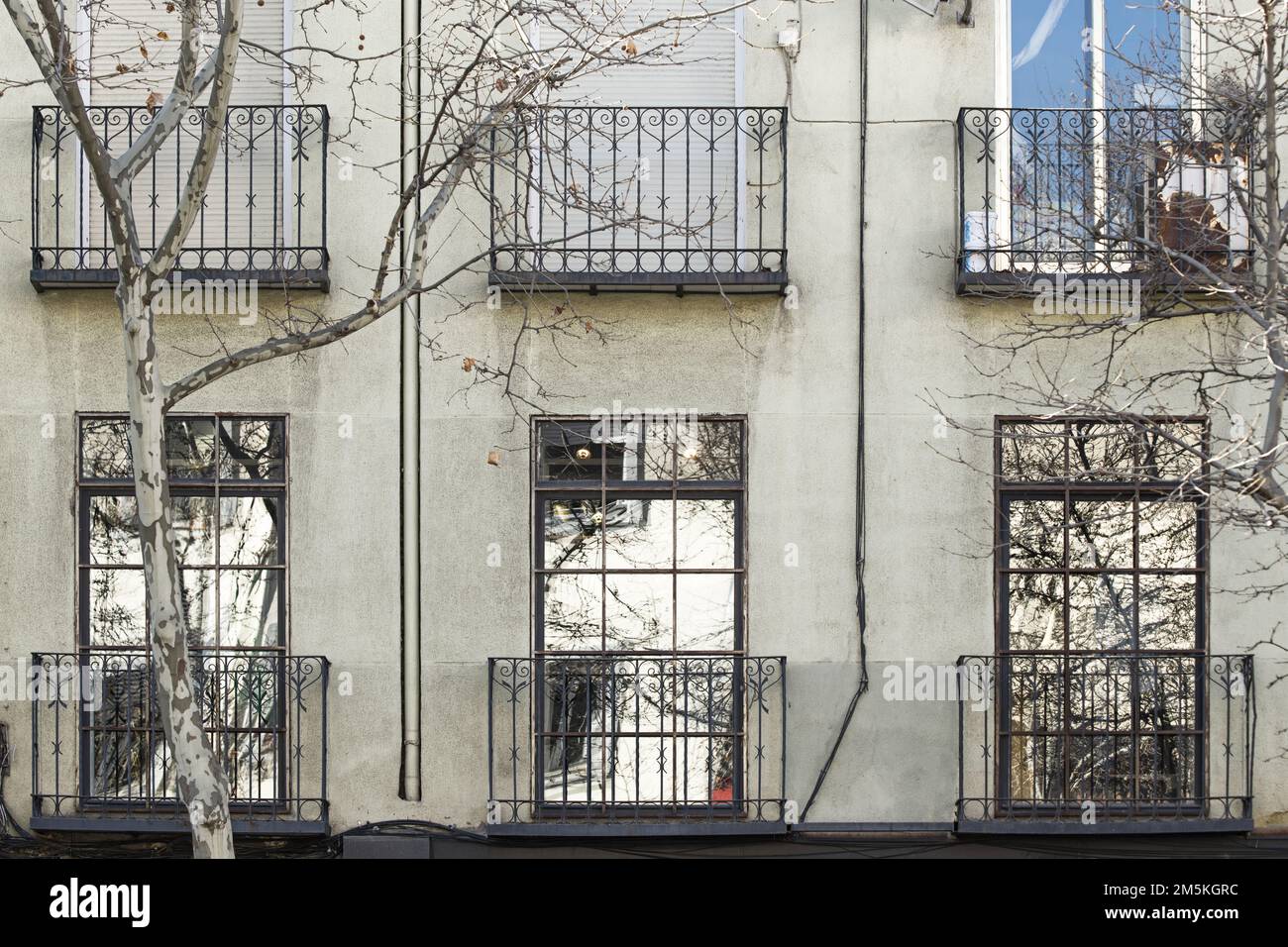 Facade of a building with balconies with wrought iron bars and French ...