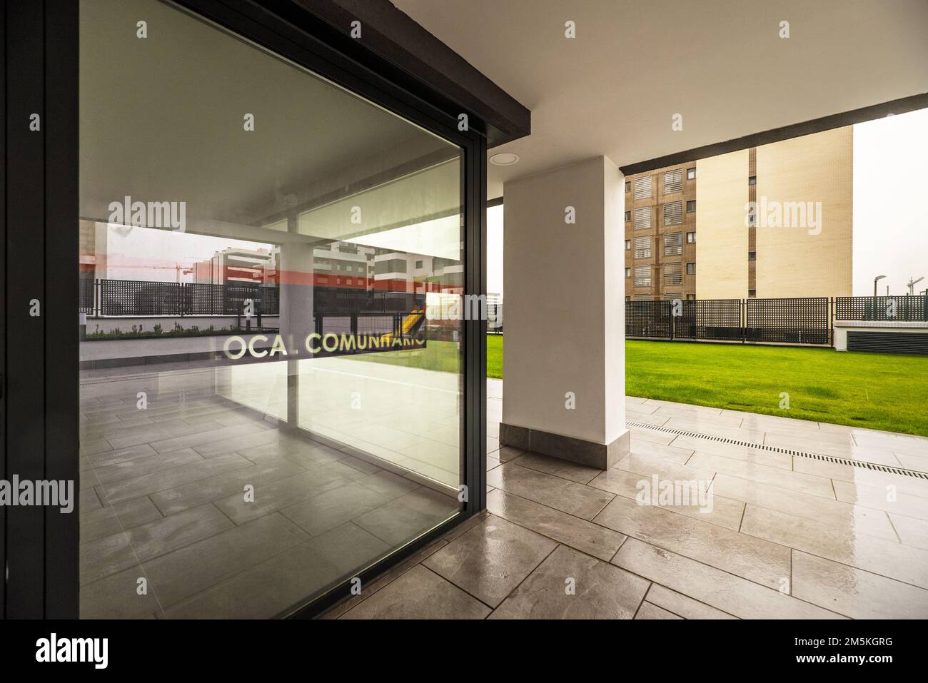 Common areas of a newly built urbanization with gardens and grass on a