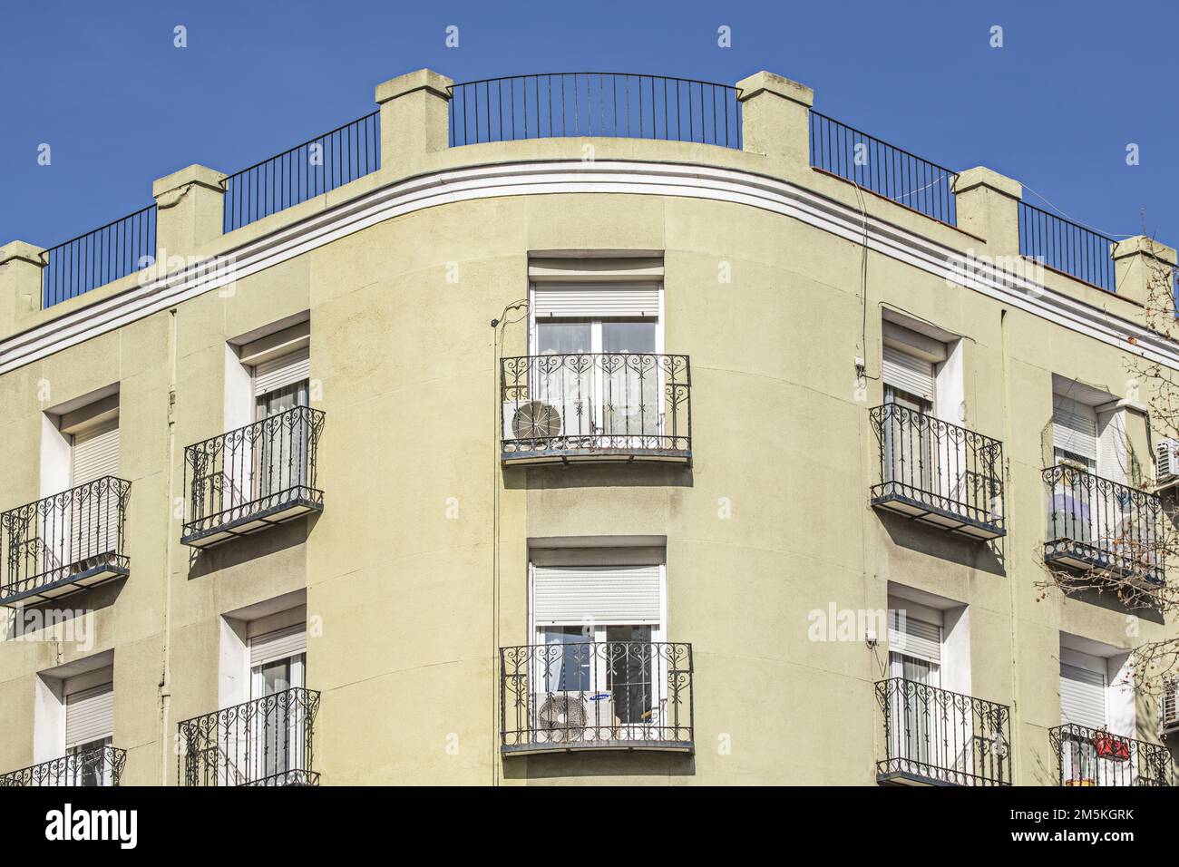 Facade of a building with balconies with black metal wrought iron ...