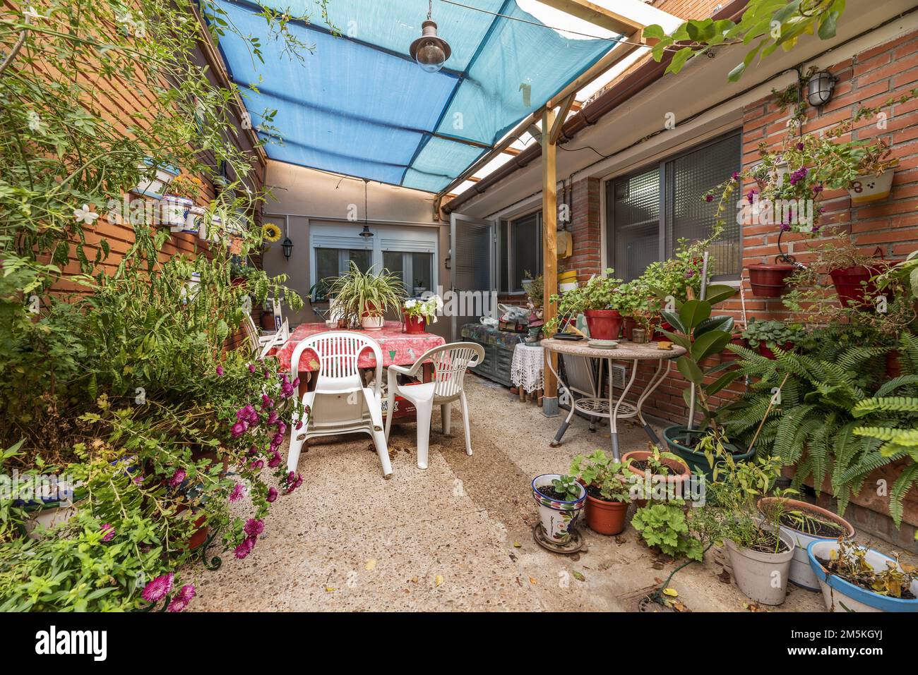 Inner patio with exposed adobe, flowerpots of the same material
