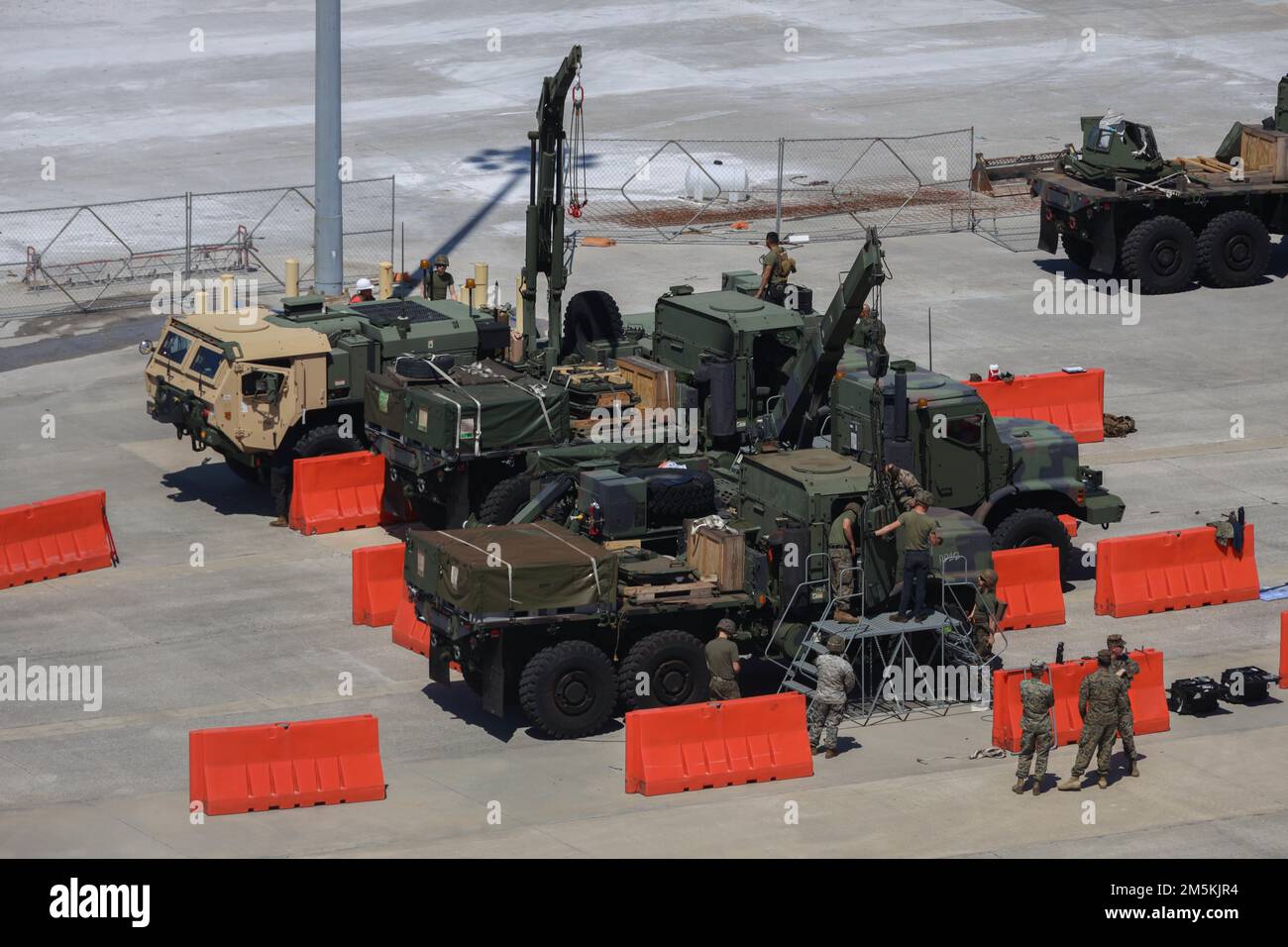 U.S. Marines operate a Medium Tactical Vehicle Replacement AMK 23 Cab