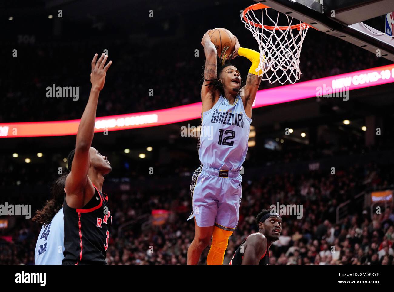 Memphis Grizzlies guard Ja Morant (12) dunks against the Toronto Raptors  during first half NBA basketball action in Toronto on Thursday, December  29, 2022. THE CANADIAN PRESS/Frank Gunn Stock Photo - Alamy