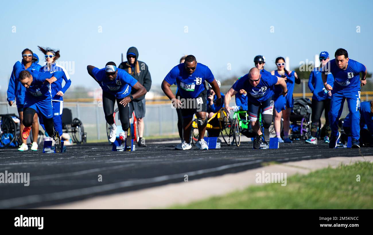 U.S. Air Force Wounded Warrior athletes compete in the men's 200-meter race during a track and field competition at Joint Base San Antonio-Randolph, Texas, on March 23, 2022. More than 60 wounded, ill or injured service men and women from around the world will compete in the first in-person Trials since 2019 for a spot on the 2022 U.S. Air Force Wounded Warrior Team, which will represent the Air Force at adaptive sports competitions throughout the year. Stock Photo