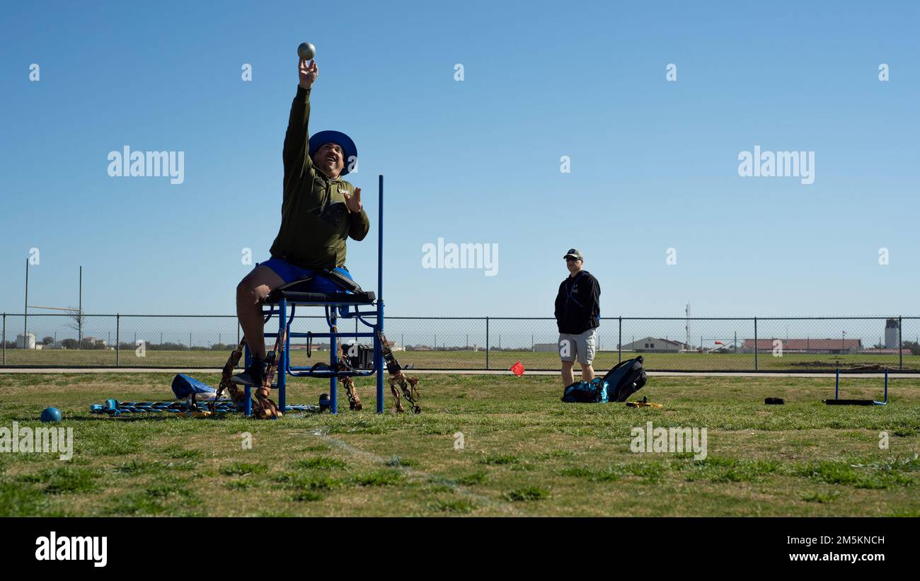U.S. Air Force Senior Master Sgt. Brian Williams, an Air Force Wounded Warrior athlete, throws a shot put during a track and field competition at Joint Base San Antonio-Randolph, Texas, on March 23, 2022. The Air Force Wounded Warrior Program is designed to provide personalized care, services and advocacy to wounded, ill or injured recovering service members. Stock Photo