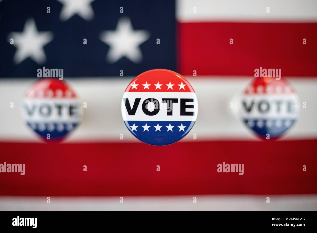 Vote button with an American flag in the background Stock Photo - Alamy