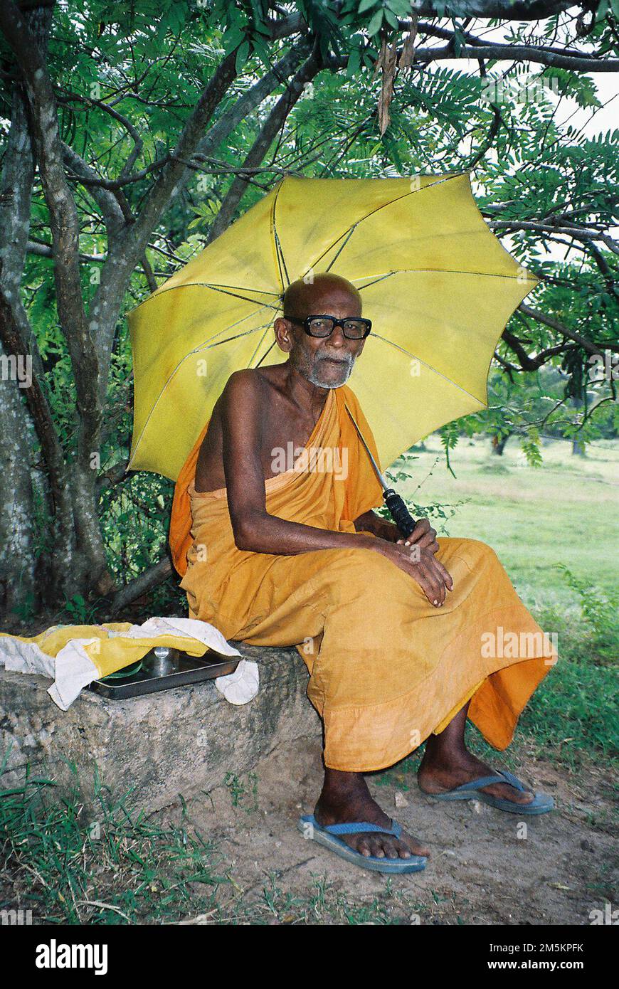 Portrait of a Buddhist monk taken by the historical temples of Anuradhapura, Sri Lanka. Stock Photo