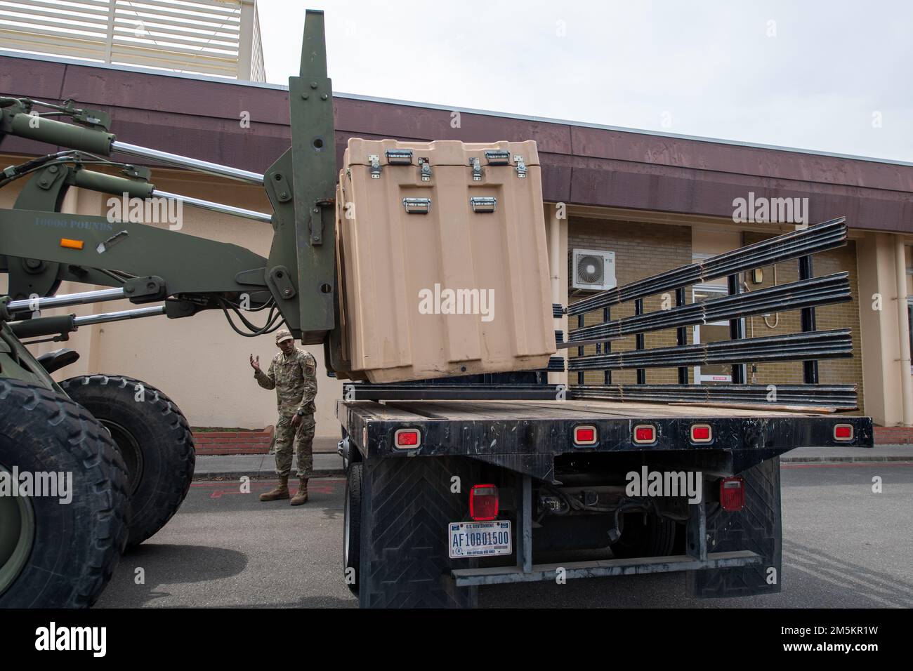 A cargo box containing the dissembled parts of the former COVID-19 testing tent is placed on a truck at Yokota Air Base, Japan, March 23, 2022. The removal of the tent was a pivotal and symbolic moment, showcasing Yokota’s commitment to following the U.S. Center of Disease Control guidance and Department of Defense policies, but also for returning to a state of normalcy for Airmen and families. Stock Photo