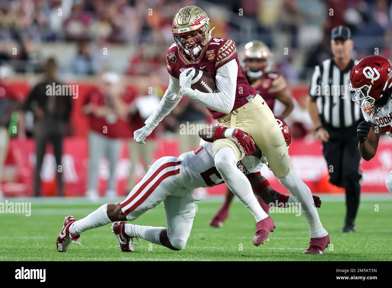 December 29, 2022: Florida State Seminoles wide receiver JOHNNY WILSON (14) runs with the ball after a reception during the 2022 NCAA Cheez-It Bowl game between the Florida State Seminoles and Oklahoma Sooners at Camping World Stadium in Orlando, FL on December 29, 2022. (Credit Image: © Cory Knowlton/ZUMA Press Wire) Stock Photo