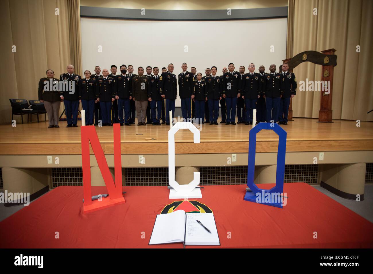 46th Aviation Support Battalion, 16th Combat Aviation Brigade hosted a NCO Induction Ceremony at Evergreen Theater, Joint Base Lewis-McChord, Wash., on March 23, 2022. The ceremony served as a rite of passage for 22 newly promoted NCOs in 46th ASB and HHC, 16th CAB. Stock Photo