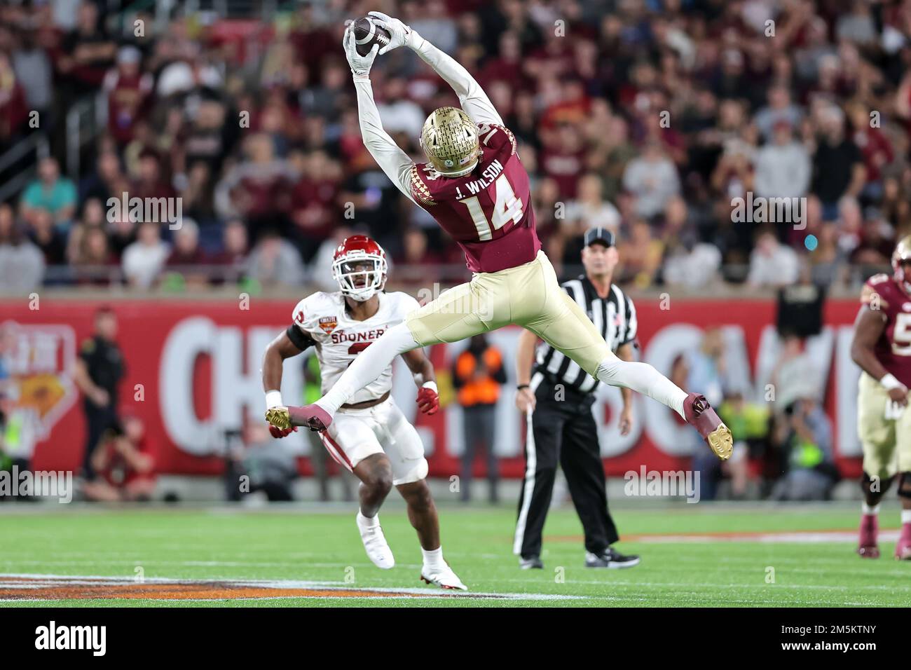 December 29, 2022: Florida State Seminoles wide receiver JOHNNY WILSON (14) reaches for a catch during the 2022 NCAA Cheez-It Bowl game between the Florida State Seminoles and Oklahoma Sooners at Camping World Stadium in Orlando, FL on December 29, 2022. (Credit Image: © Cory Knowlton/ZUMA Press Wire) Stock Photo