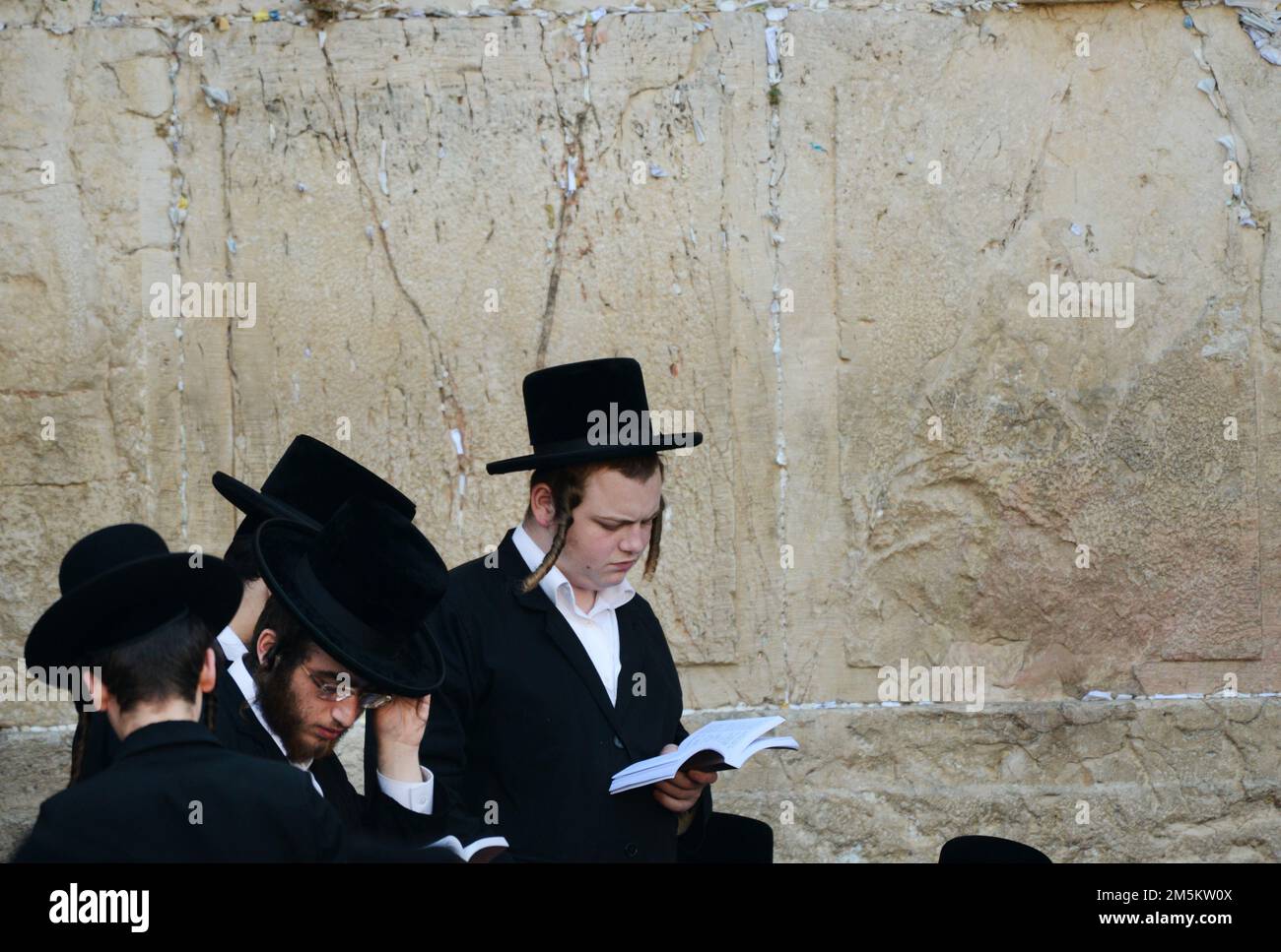 A Jewish man praying by the Wailing wall on Tisha B'Av day at the old city of Jerusalem. Stock Photo