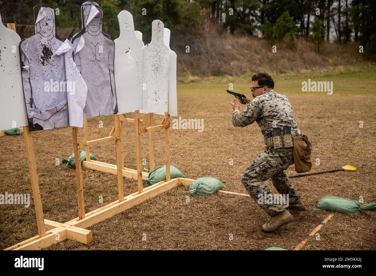 U.S. Marines with 2nd Intelligence Battalion (2D Intel Bn) and 8th Communication Battalion (8th Comm Bn), II Marine Expeditionary Force Information Group, compete in the 2022 Marine Corps Marksmanship Competition East on Stone Bay, N.C., March 21-25, 2022. Out of 231 competitors. Capt. Frank Gao, a communications officer with 8th Comm Bn earned second place in the individual pistol portion, and Sgt. Kenika Beck, a radio operator with 2D Intel Bn, earned 20th in the same category. Stock Photo