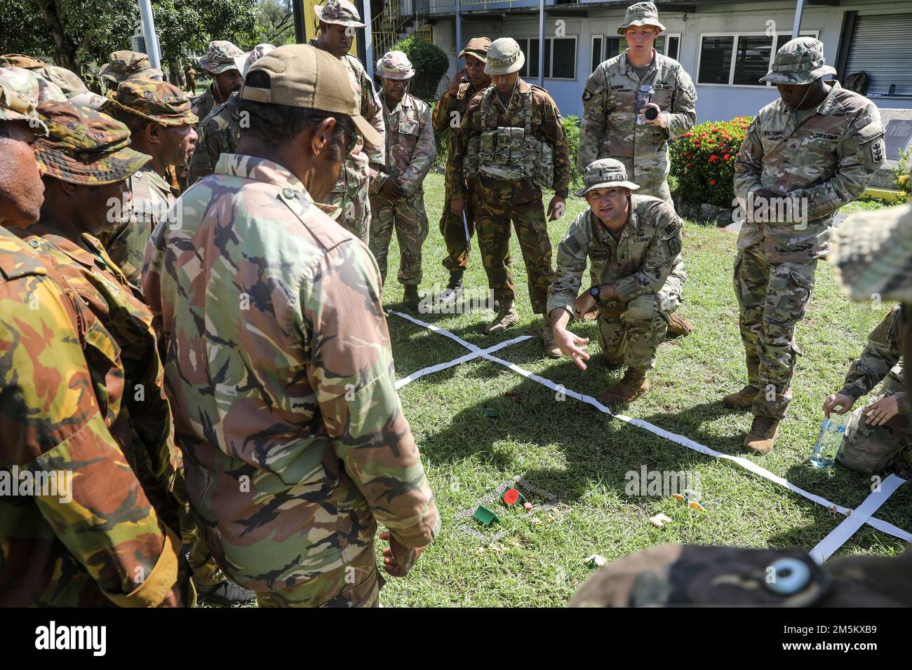 U.S. Army Soldiers from the 130th Engineer Brigade and 8th Military Police Brigade train the Papua New Guinea Defense Forces on room clearing, platoon level cordon and search, and tactical combat casualty care during Tamiok Strike 22 in Port Moresby on March 24. The training prepared the PNG Defense force for future scenario based practical exercises. Combined military readiness and responsiveness requires combined training. Tamiok Strike 2022 allows our nations to come together to test bilateral concepts in support of the Mutual Defense Treaty. Tamiok Strike 22 is a bilateral Army to Army mil Stock Photo