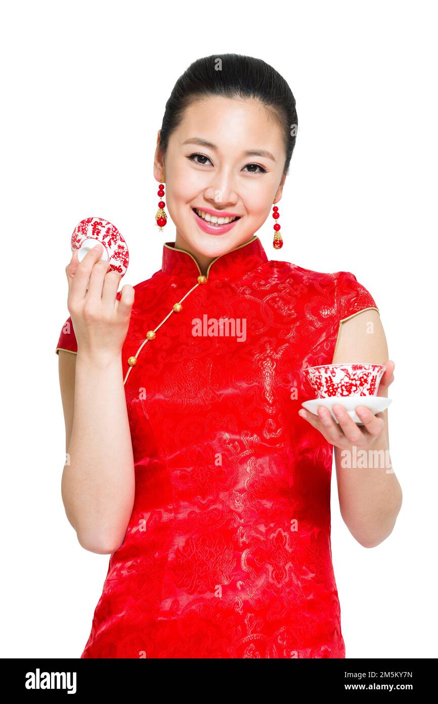 Take the young woman in red cheongsam Stock Photo - Alamy