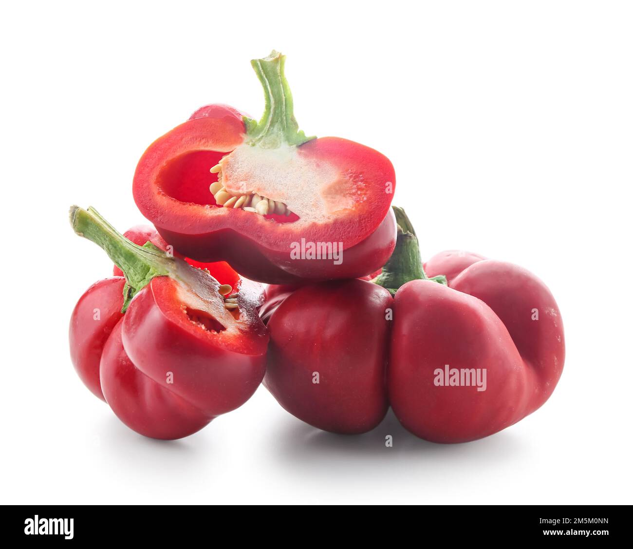 Red bell peppers on white background Stock Photo - Alamy