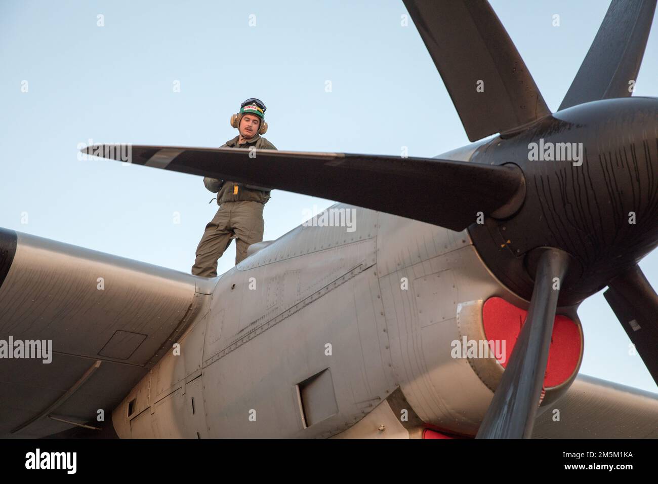 U.S. Marine Corps Sgt. Calvin Shirey, a loadmaster with Marine Aerial Refueler Transport Squadron (VMGR) 152, conducts preflight checks on a KC-130J Super Hercules at Yokota Air Force Base, Japan, March 24, 2022. Marines with VMGR-152 supported Marines with Marine Fighter Attack Squadron 121 during a training flight simulating close air support at Camp Fuji, Japan. Marine Corps aviation routinely conducts training throughout the region to remain combat-ready in support of a free and open Indo-Pacific and to demonstrate our commitment to the Treaty of Mutual Cooperation and Security between the Stock Photo