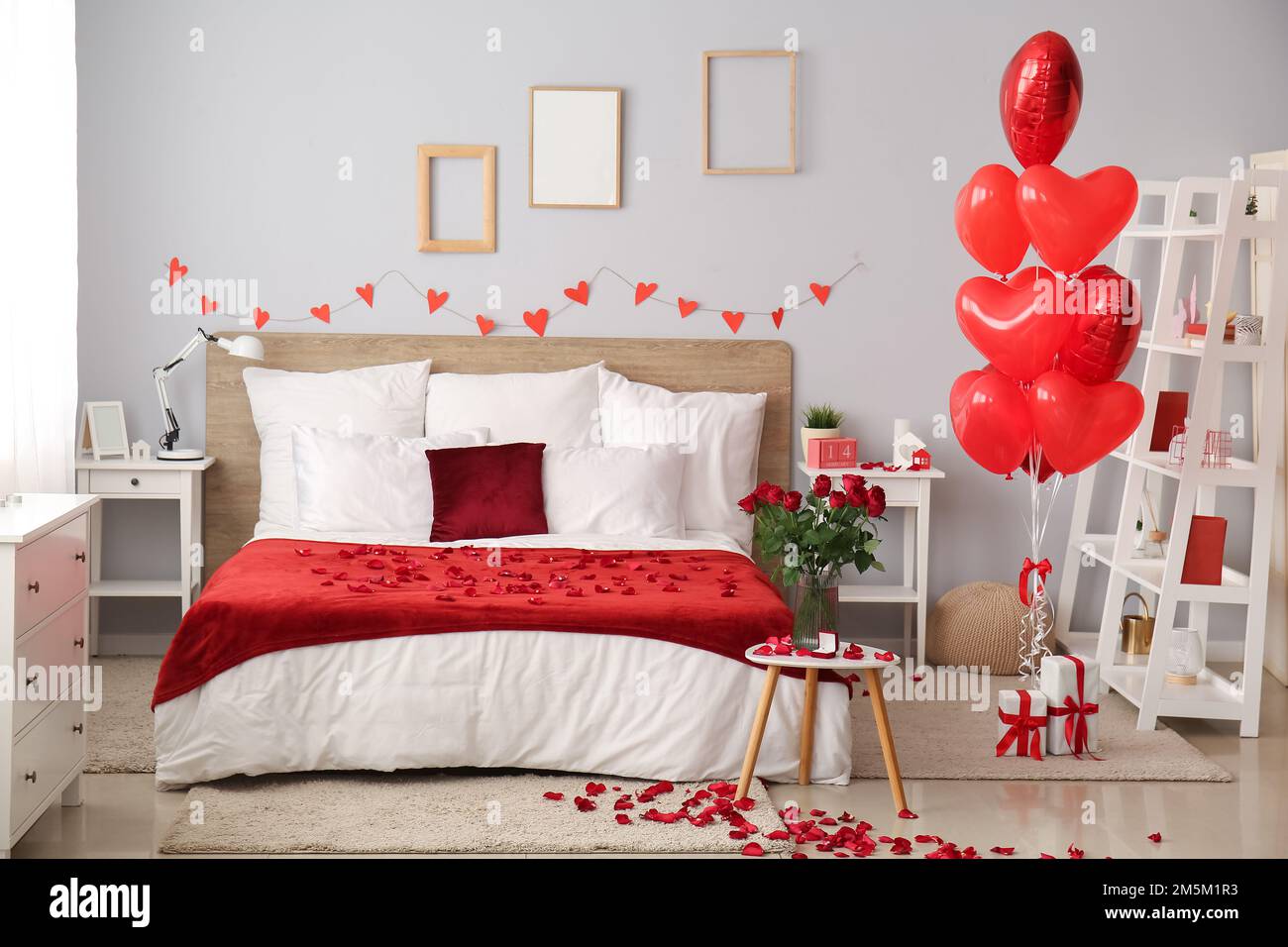 Interior of bedroom decorated for Valentine\'s Day with roses ...
